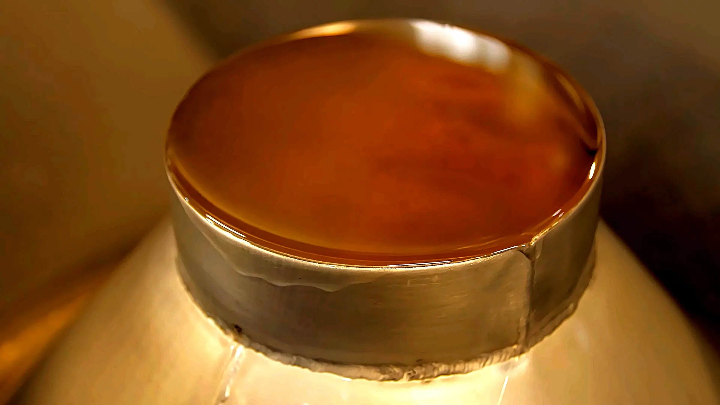 Caledonian sandalwood oil, amber surface